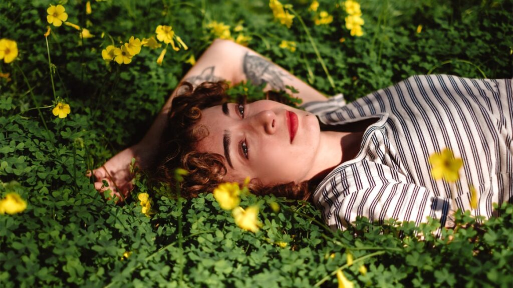 woman laying in the grass