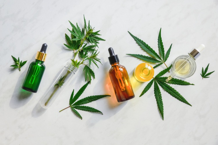 cannabis leaves tinctures and test tubes